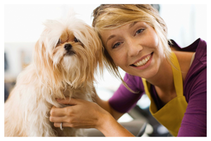 dog with its groomer